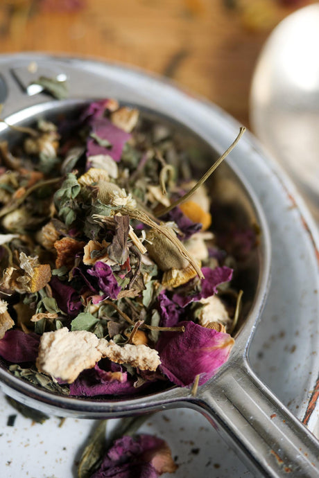 Super chilled Organic herbal tea in tea strainer