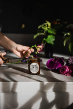 Load image into Gallery viewer, cutting flowers next to cutting garden soy candle by mabel + meg